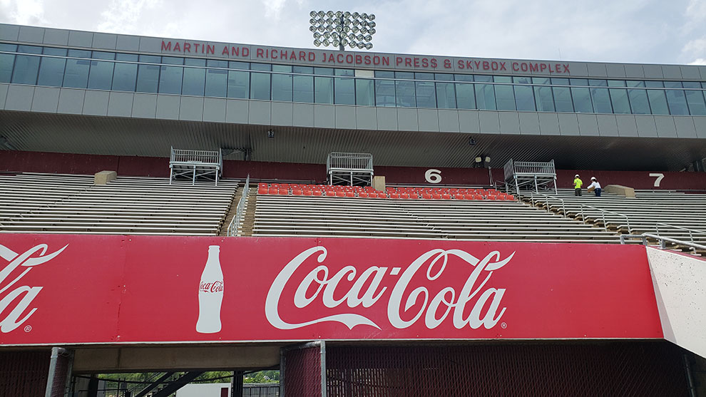 interior view of McGuirk stadium showing Coca-Cola sign and bleachers