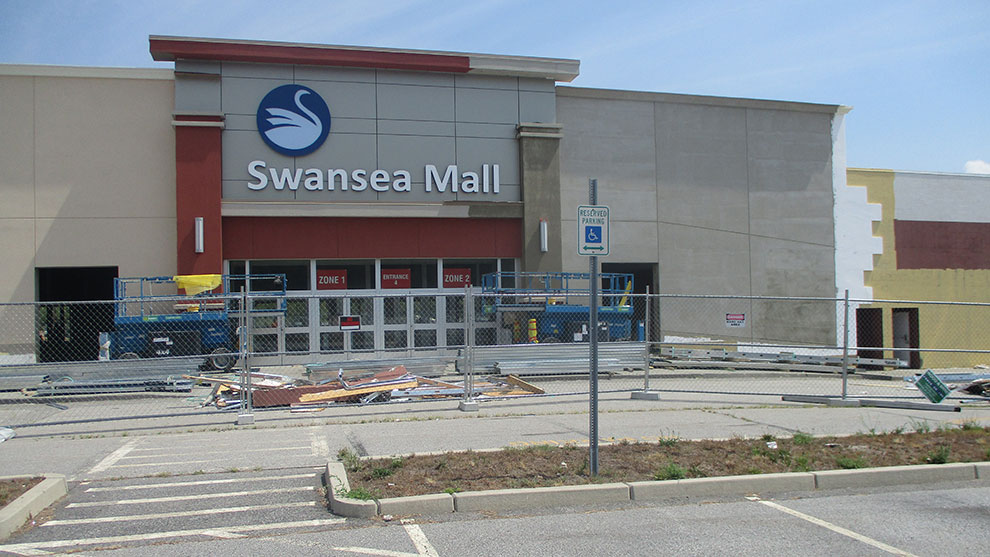 exterior view of Swansea mall building with sign