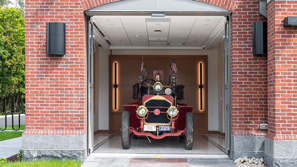 Antique fire truck in a garage bay